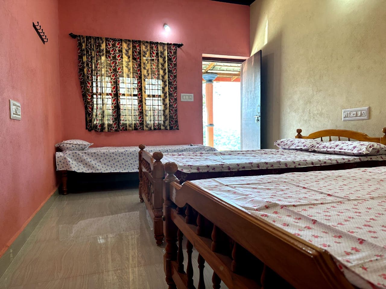 Room with three beds suitable for a group at Satish Mullodi Home Stay, Kudremukh
